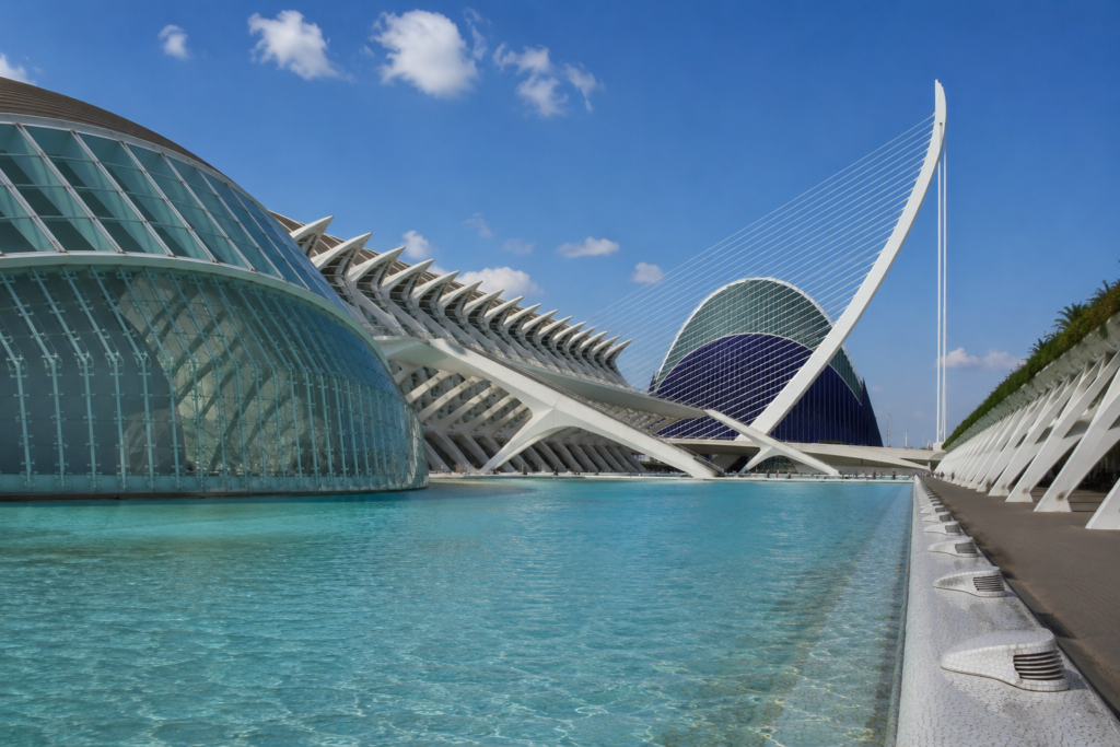 The City of Arts and Sciences in Valencia, Spain, featuring its iconic modern architecture and reflecting pools on a sunny day.